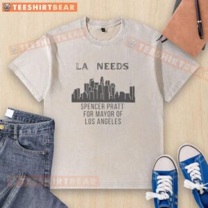 Spencer Pratt in Los Angeles wearing a 'Mayor of LA' washed t-shirt against a vibrant cityscape backdrop.