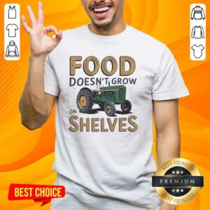Vintage T-Shirt featuring a nice tractor and the phrase 'Food Doesnt Grow On Shelves' for farm and gardening enthusiasts.