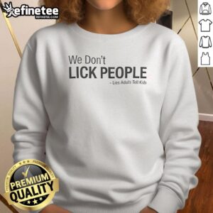 Premium We Don't Lick People Lies Adults Tell Kids Sweatshirt in cozy fabric, perfect for playful family moments.