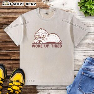 Sloth wearing a 'Hot Woke Up Tired' washed t-shirt, showcasing a relaxed and humorous style in a cozy setting.