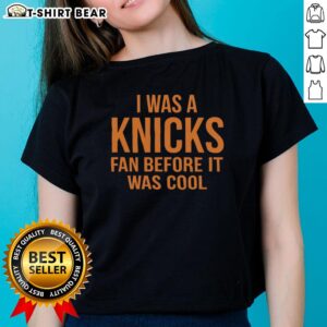 Alt Text: Ladies tee featuring 'I Was A Knicks Fan Before It Was Cool' in orange text, perfect for New York Knicks fans.