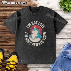 Alt Text: Cute Snorlax Pokemon graphic on a washed t-shirt with 'I'm not lazy, I'm just always tired' slogan.