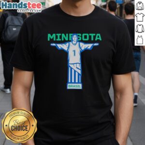Anthony Edwards wearing a Nice Minnesota Basketball T-shirt featuring Christ The Redeemer in Brazil.