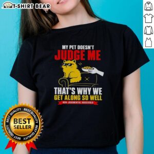 Playful orange cat relaxing on a tee, showcasing the bond of unconditional love and no judgment between pet and owner.