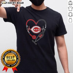 Alt Text: Top Cincinnati Reds Stethoscope Heartbeat T-Shirt, featuring a heart design celebrating baseball and passion for the Reds.