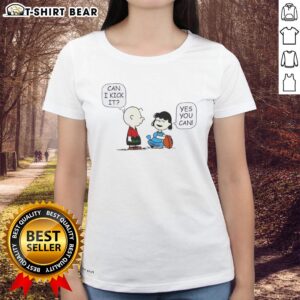 Top Charlie Brown and Lucy Can I Kick It Ladies Tee featuring iconic Peanuts characters in a fun design.