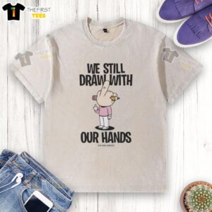 Alt Text: Premium We Still Draw With Our Hands washed T-shirt, showcasing a creative design perfect for artists and enthusiasts.