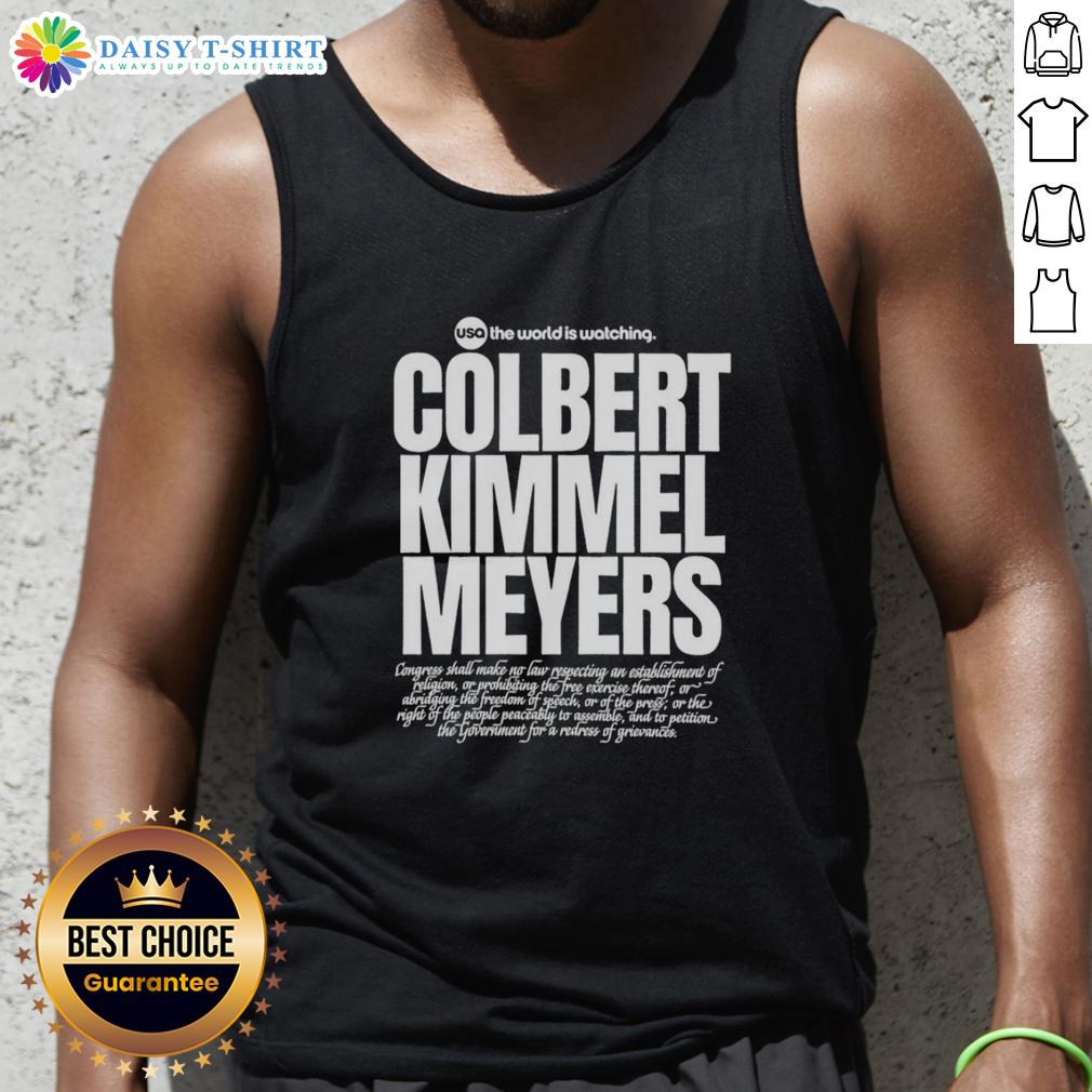 Top Usa The World Is Watching Colbert Kimmel Meyers Tank Top Top USA tank top featuring 'The World Is Watching' design with Colbert, Kimmel, and Meyers for trendy casual wear.