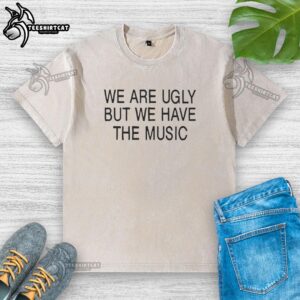 Premium 'We Are Ugly But We Have The Music' washed t-shirt featuring a stylish graphic design and soft fabric.