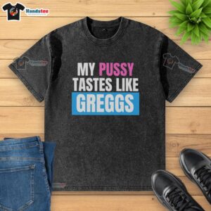 Close-up of a washed Greggs t-shirt with a playful slogan about taste, showcasing vibrant colors and soft fabric.
