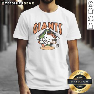 Alt Text: Cute orange San Francisco Giants Hello Kitty T-shirt featuring a playful design perfect for fans and collectors.