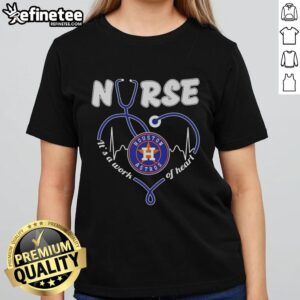 Alt Text: Ladies tee featuring 'It's a Work of Heart' design for Houston Astros nurses, perfect for showing team spirit.