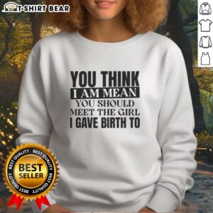 Woman wearing 'Good You Think I Am Mean' sweatshirt, showcasing humor and motherhood pride.