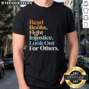 Retro T-shirt featuring 'Top Read Books Fight Injustice Look Out For Others' slogan, promoting social awareness and literature.