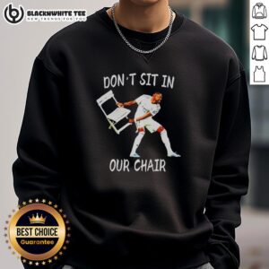 David Alaba celebrates in a stylish sweatshirt with 'Don't Sit In Our Chair' slogan, perfect for fans and fashion lovers.