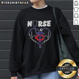 Original Minnesota Twins Nurse 'It's A Work Of Heart' Sweatshirt featuring team colors and heart design for fans.