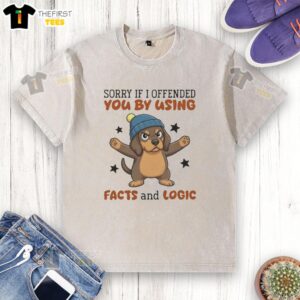 Grumpy dachshund in a beanie and washed t-shirt, expressing Sorry if I offended you by using facts and logic.