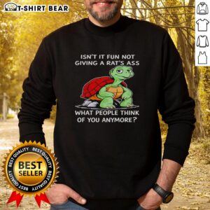 Cozy black sweatshirt with 'Isn't It Fun Not Giving A Rat's Ass What People Think of You Anymore' graphic design.