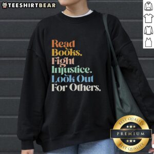 Retro sweatshirt featuring 'Top Read Books Fight Injustice' design, perfect for book lovers advocating for social change.