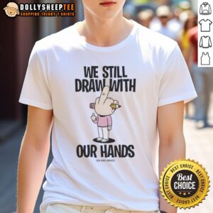 Official We Still Draw With Our Hands T-Shirt featuring bold graphic design and comfortable fit for artists and creatives.
