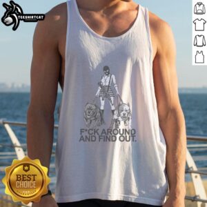 Girl in a balaclava mask walking two dogs, wearing a Fuck Around and Find Out tank top, enjoying a sunny day outside.