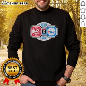 Alt Text: Top Atlanta Hawks vs Philadelphia 76ers 2026 NBA Playoffs sweatshirt featuring team logos and playoff graphics.