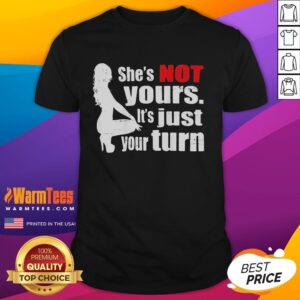 Alt Text: Premium The Woman Squatting She's Not Yours It's Just Your Turn T-Shirt displayed on a hanger in a stylish setting.
