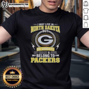 Original Green Bay Packers NFL t-shirt featuring 'I May Live In North Dakota, But My Heart Belongs To Packers' design.