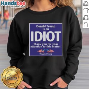 Official 'US Is An Idiot' sweatshirt from Us Against Trump, featuring bold text and a casual design for political activism.