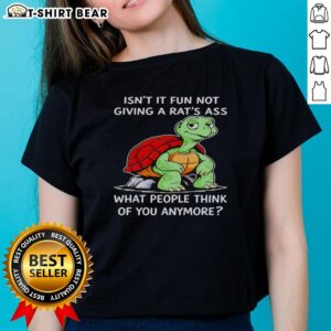 Top turtle graphic tee for ladies: 'Isn't it fun not caring what people think?' Perfect for confident style.