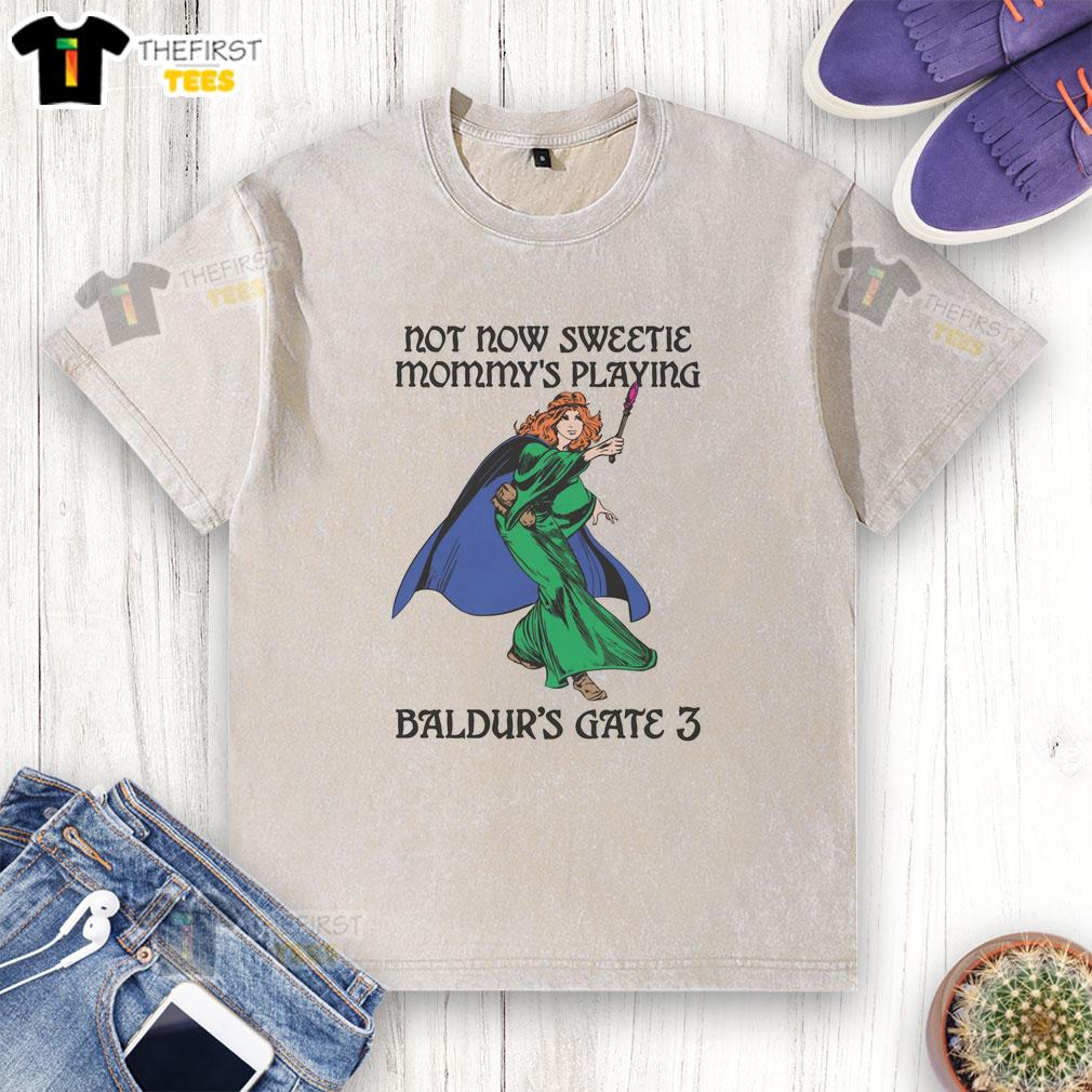 awesome-not-now-sweetie-mommys-playing-baldurs-gate-3-washed-t-shirt Awesome Not Now Sweetie Mommy's Playing Baldur's Gate 3 washed t-shirt design featuring a gamer mom graphic.