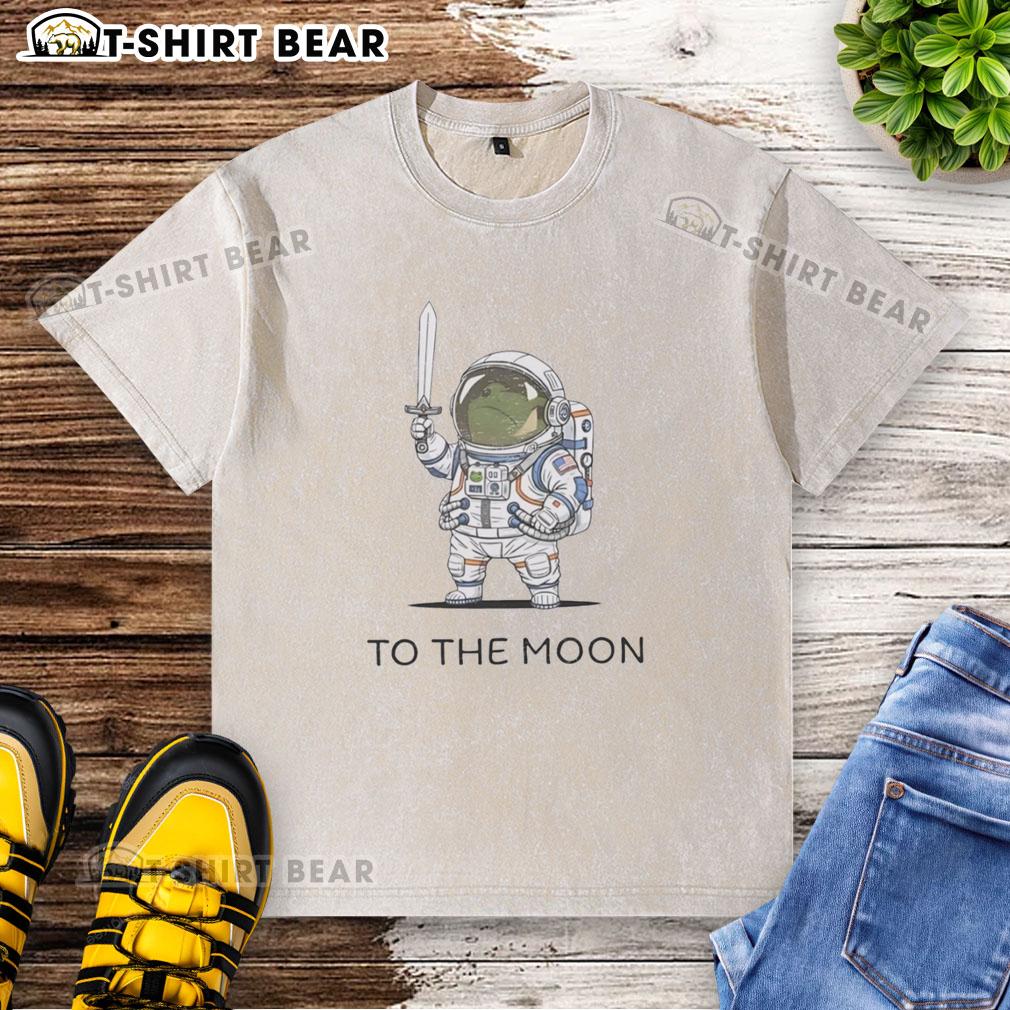 Awesome To The Moon Astronaut Frog Washed T Shirt Alt Text: Awesome to the Moon astronaut frog graphic on a washed t-shirt, perfect for casual space-themed fashion.