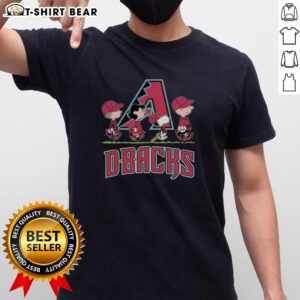 Hot Snoopy, Charlie Brown, Linus, and Lucy in Arizona Diamondbacks baseball jersey t-shirts, showcasing fun cartoon style.