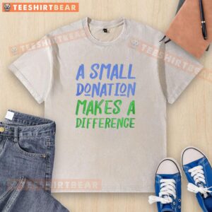 Alt Text: Good A Small Donation Makes A Difference washed t-shirt featuring a motivational message on a casual background.