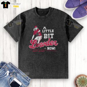Nice-A-Little-Bit-Lowder-Now washed t-shirt displayed on a wooden background, featuring a stylish design and soft fabric.