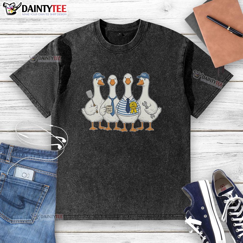 cute-funny-fathers-day-goose-group-washed-t-shirt Alt Text: Cute funny Father's Day goose group on a washed t-shirt, perfect gift for dad's special day.