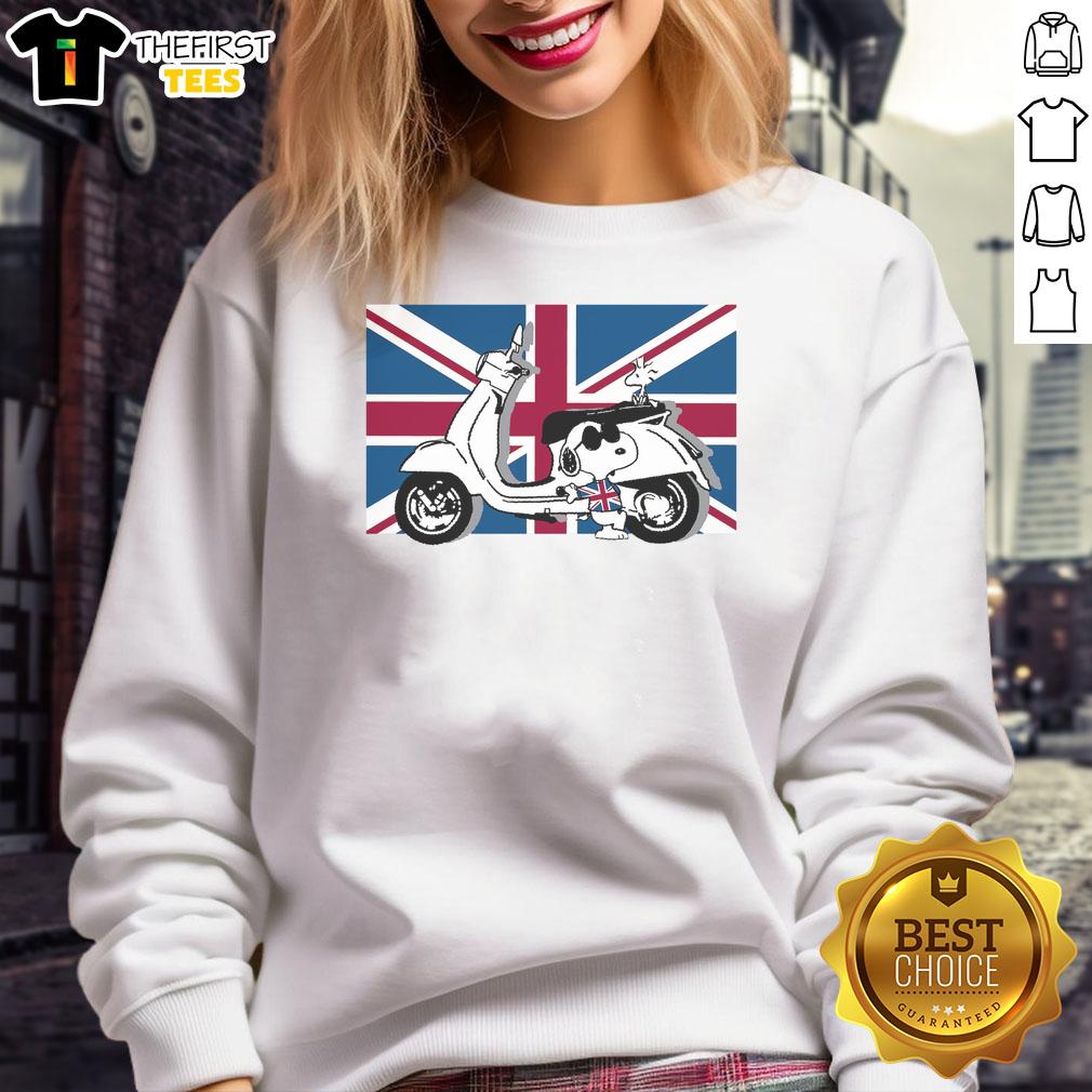 cute-peanuts-union-jack-scooter-snoopy-sweatshirt Alt Text: Cute Peanuts Union Jack Scooter Snoopy Sweatshirt featuring Snoopy riding a scooter with the Union Jack design.