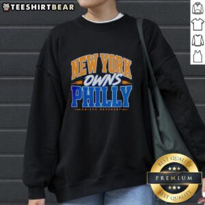 Alt Text: Awesome New York Knicks Owns Philly Rivalry Statement Basketball Sweatshirt featuring team colors and logo.