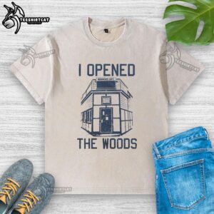 Good I Opened The Woods washed t-shirt displayed on a wooden background, featuring a nature-inspired design.