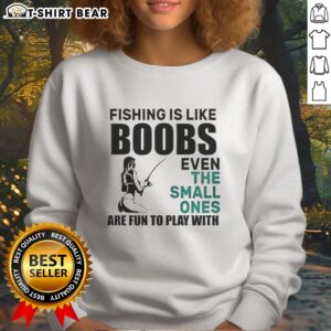 Funny meme sweatshirt featuring 'Nice Fishing Is Like Boobs' text, highlighting humor in fishing and playful design.
