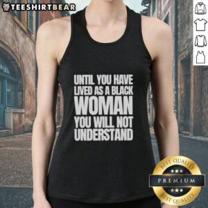 Black woman wearing a 'Nice Until You Have Lived as a Black Woman' tank top, showcasing empowerment and identity.