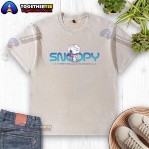 Alt Text: Nice Peanuts Snoopy beagle roaming in space on a washed t-shirt, showcasing a playful and colorful design.