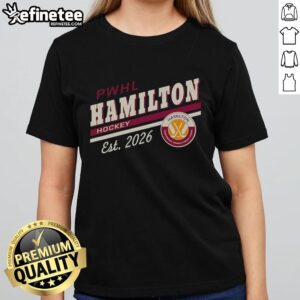 Alt Text: Official PWHL Hamilton Hockey Est 2026 logo on a ladies tee, showcasing team spirit and women's hockey pride.
