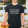 Good Educators Against Fascism T-Shirt featuring bold text and a graphic design promoting anti-fascism in education.