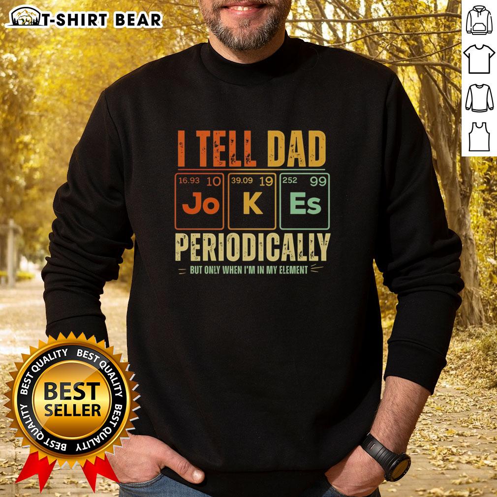 Good I Tell Dad Jokes Periodically But Only When I'm In My Element Retro Sweatshirt Man wearing a 'Good I Tell Dad Jokes Periodically' retro sweatshirt in a cozy, casual setting, showcasing humor and style.