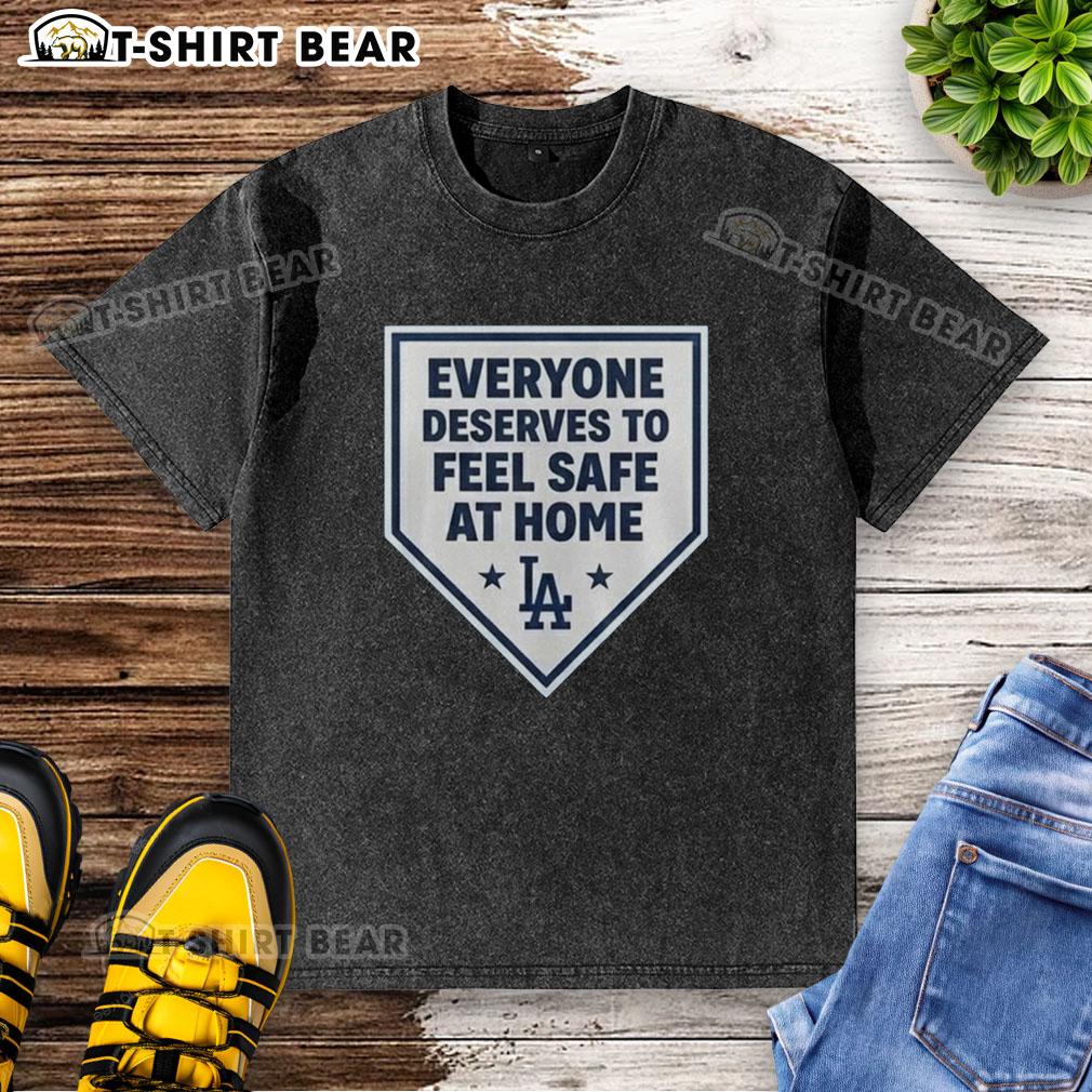 Good Los Angeles Dodgers Everyone Deserves To Feel Safe At Home Washed T Shirt Good Los Angeles Dodgers 'Everyone Deserves To Feel Safe At Home' washed t-shirt displayed on a wooden background.