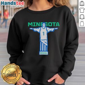 Alt Text: Anthony Edwards wearing a Christ the Redeemer sweatshirt in Nice, Minnesota, showcasing basketball style and flair.