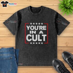 Original You're In A Cult Satirical Political Statement Stars Washed T-Shirt featuring bold graphic design and vibrant colors.