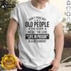Funny 'Don't Piss Off Old People' T-shirt featuring humorous text about aging and prison deterrents for older adults.