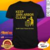 Hot Keep Ann Arbor Clean Dump Your Trash In Ohio T-Shirt featuring a bold graphic and eco-friendly message.